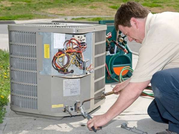 Local electrician working on AC Installation in Saskatoon