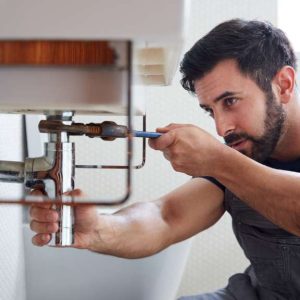 Plumber detecting hidden plumbing leaks in Saskatoon.